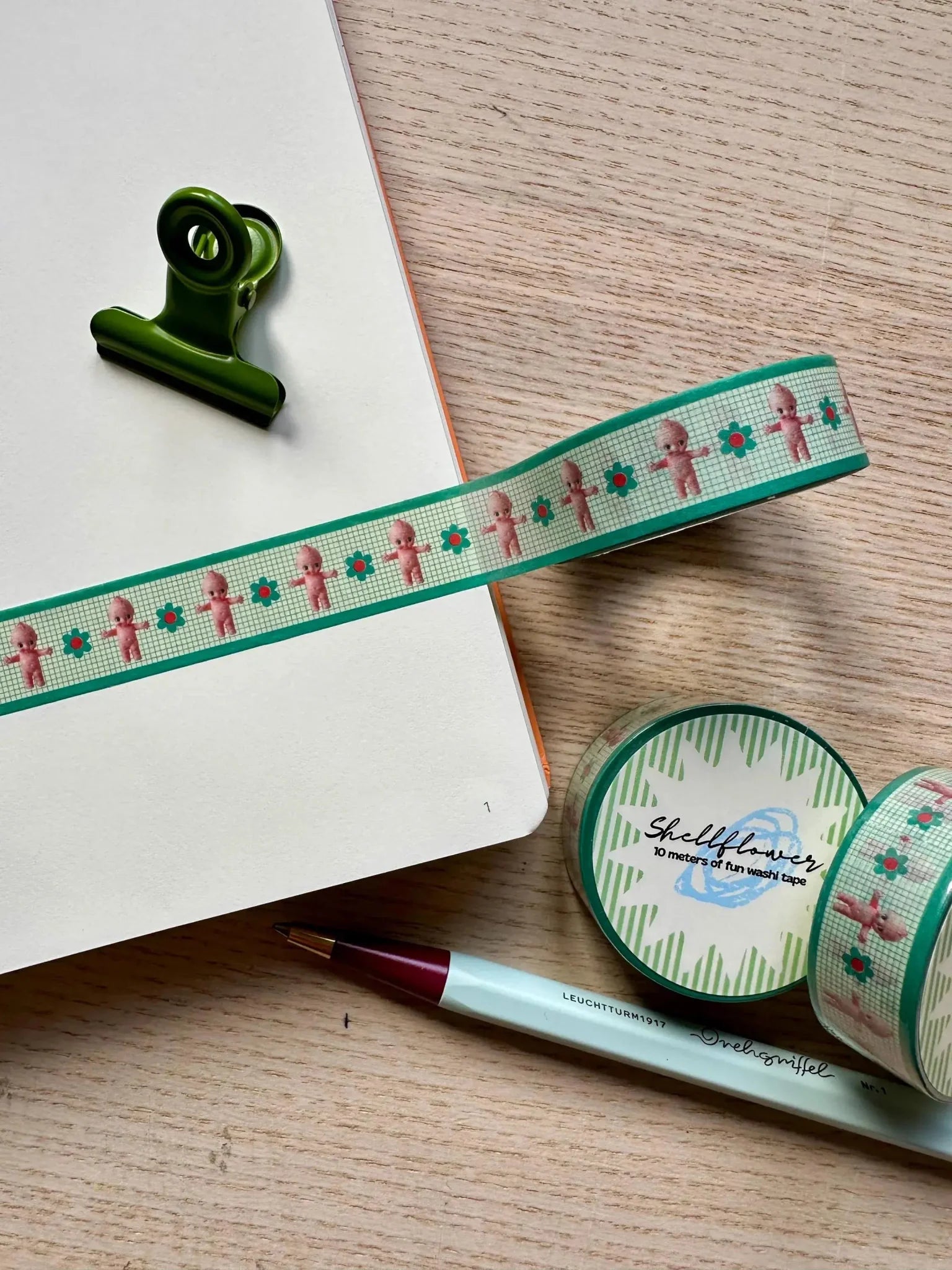 Collage featuring cute stickers, notebooks, pens, pencil cases, pouches, and sticker books