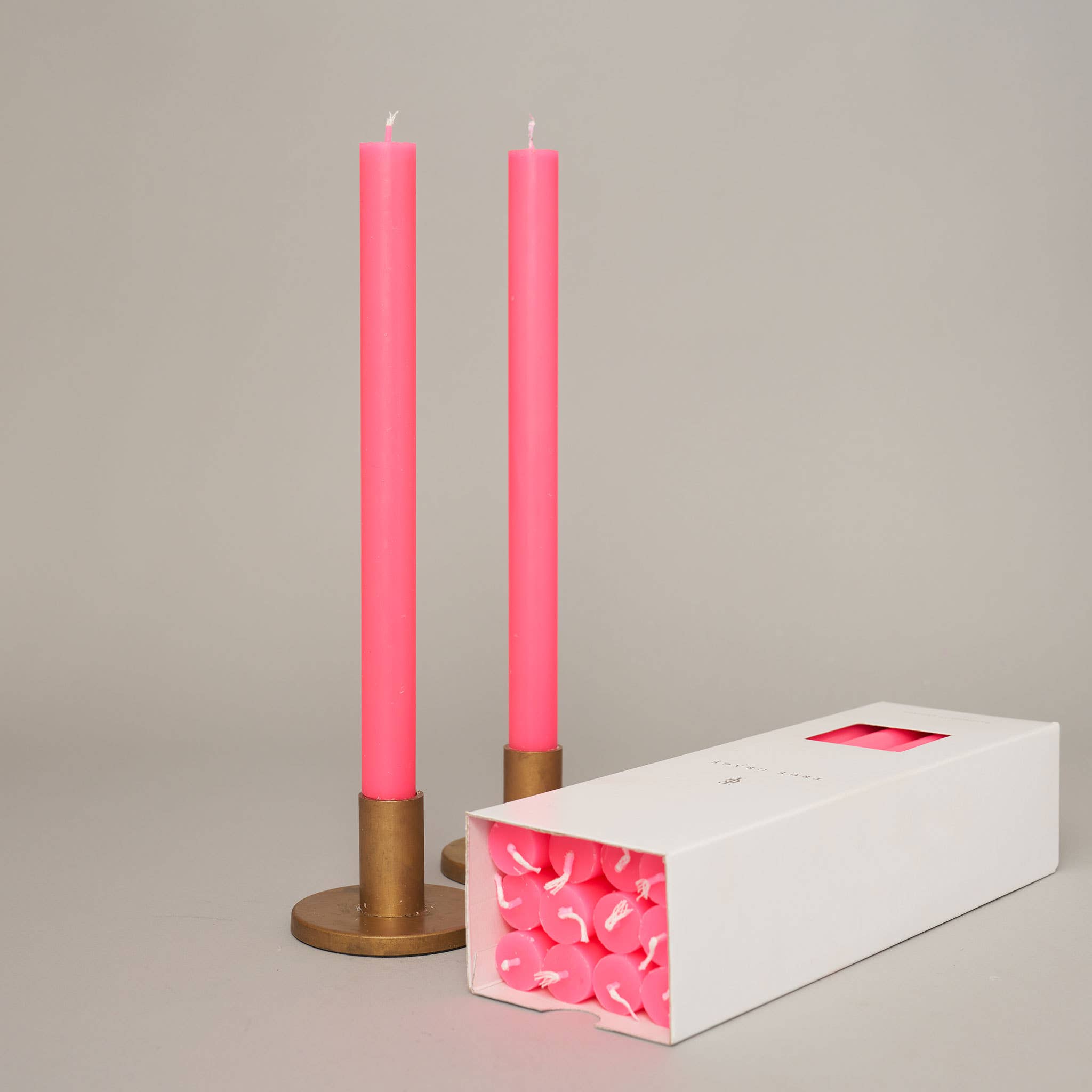 True Grace tall dinner candle in fluro pink