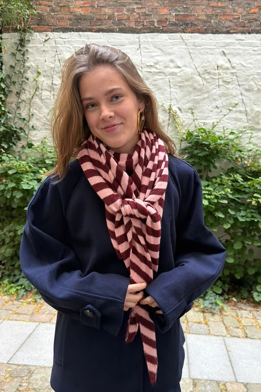 Bordeaux and taupe Nordic Stripe scarf styled with a winter coat