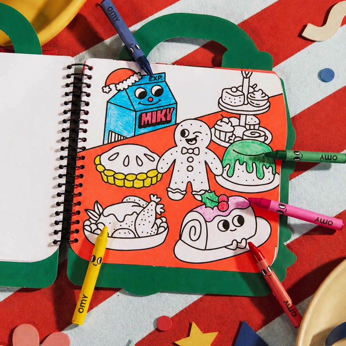 Colouring a page of the OMY Christmas super colouring book