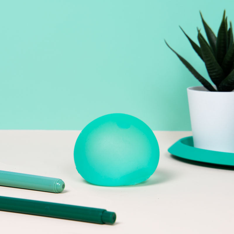 Speks Gump Original in Sea Glass on a desk