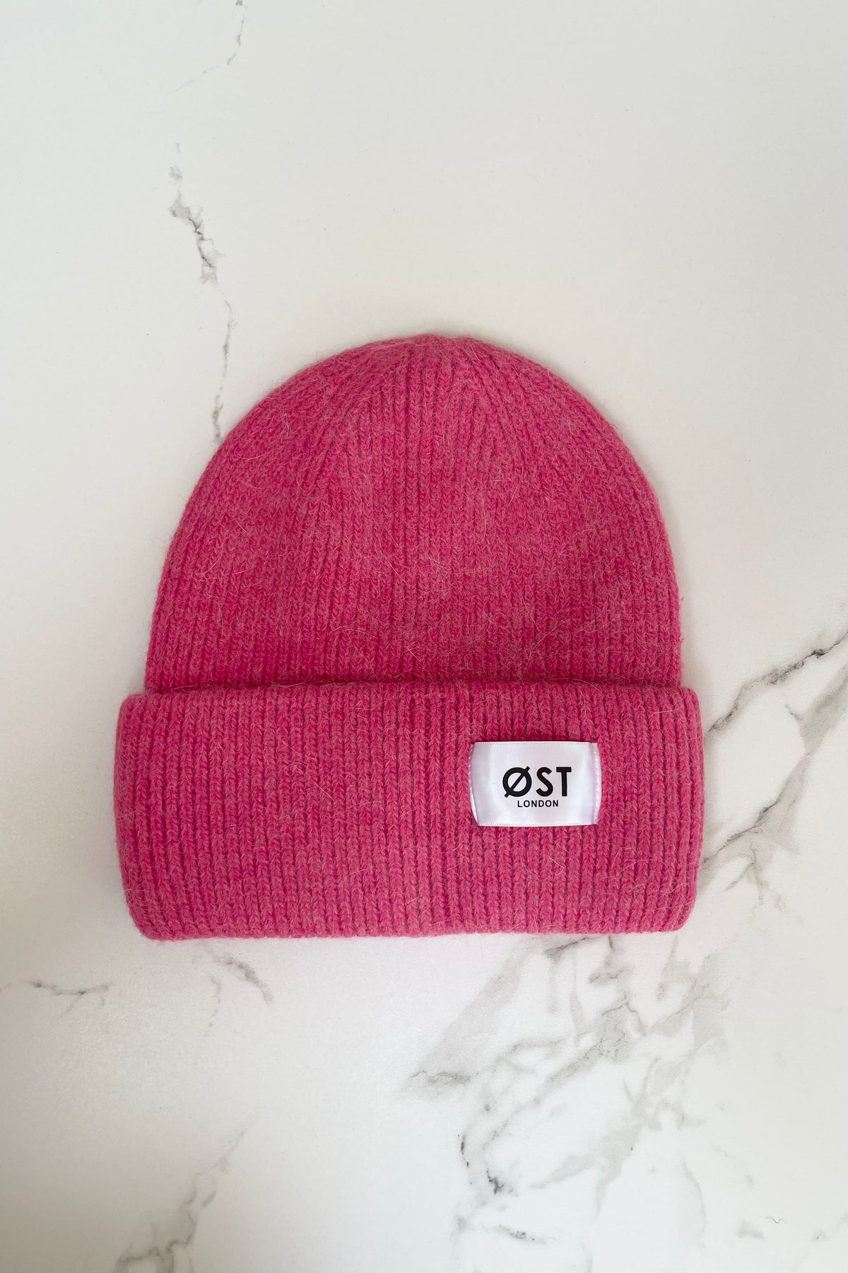 Fuchsia knitted beanie worn slouchy