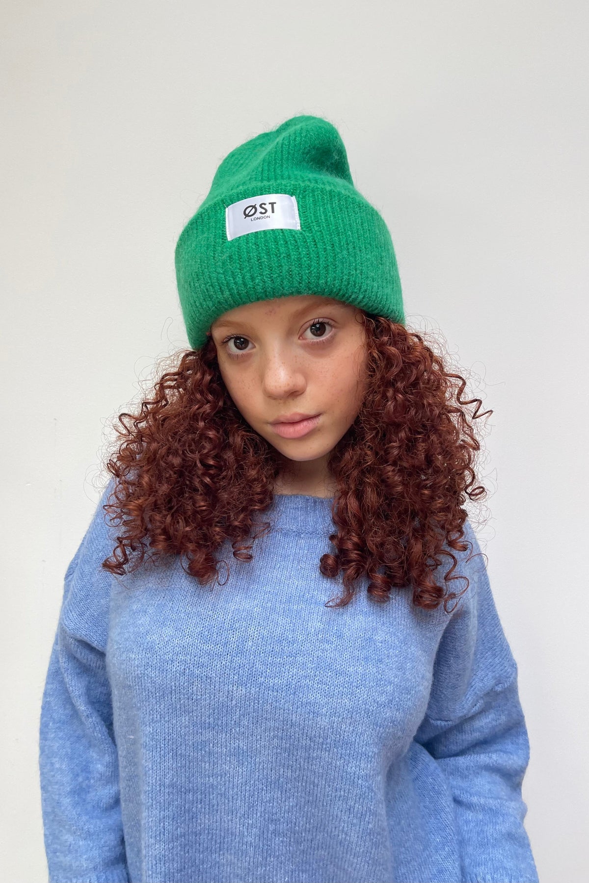 Apple green knitted beanie worn slouchy