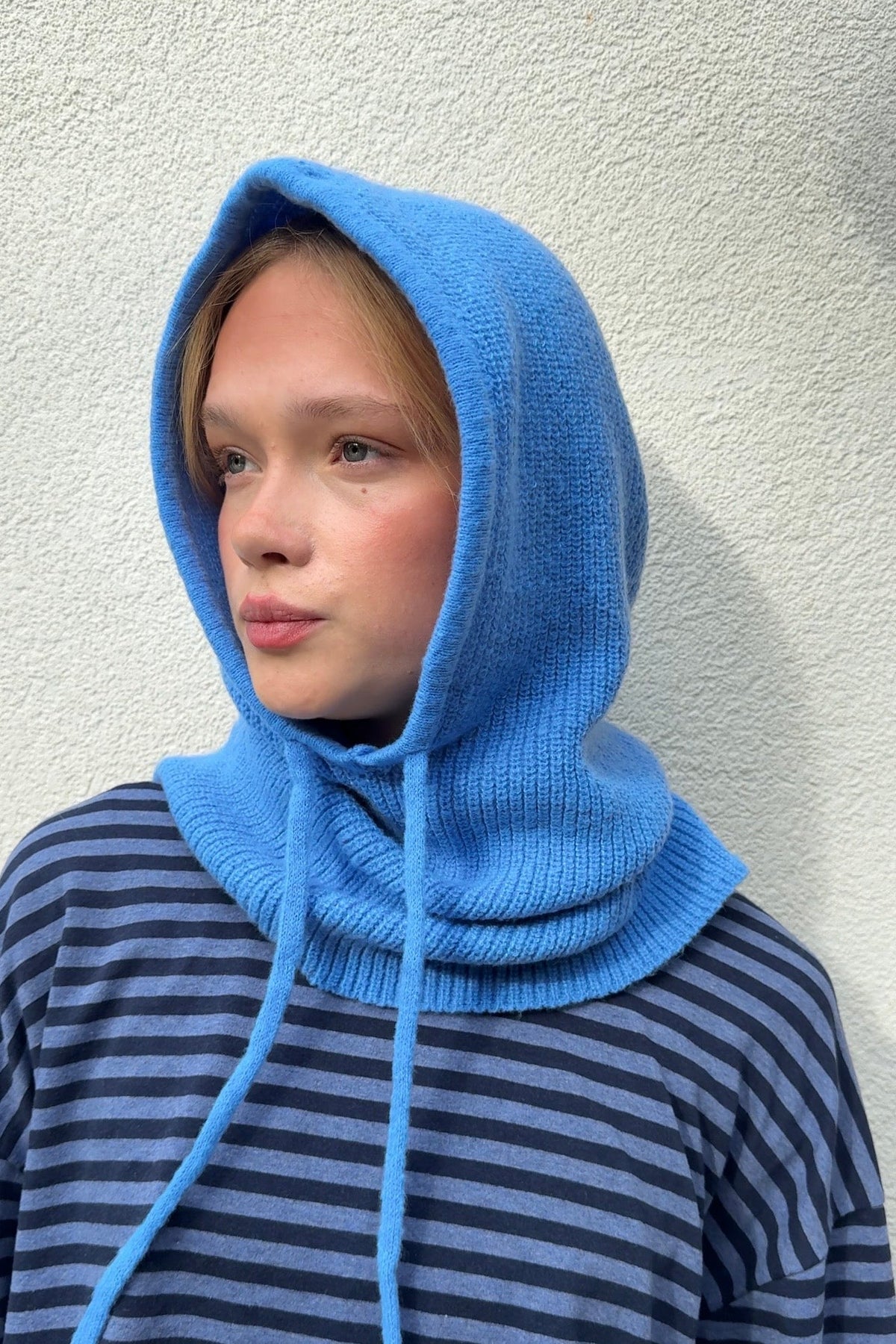 Cornflower blue cashmere blend balaclava worn as a hood