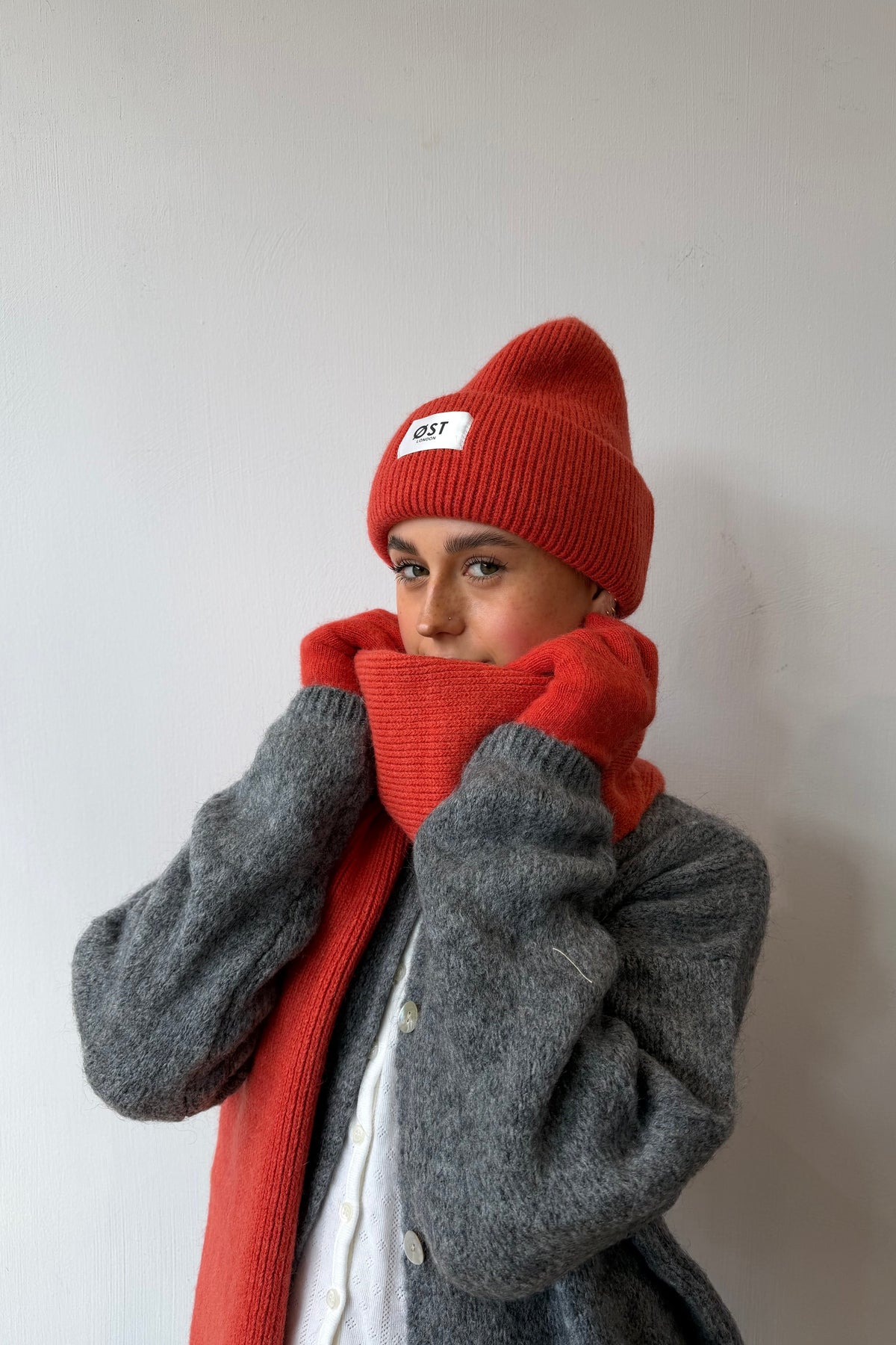 Blood orange knitted beanie worn slouchy
