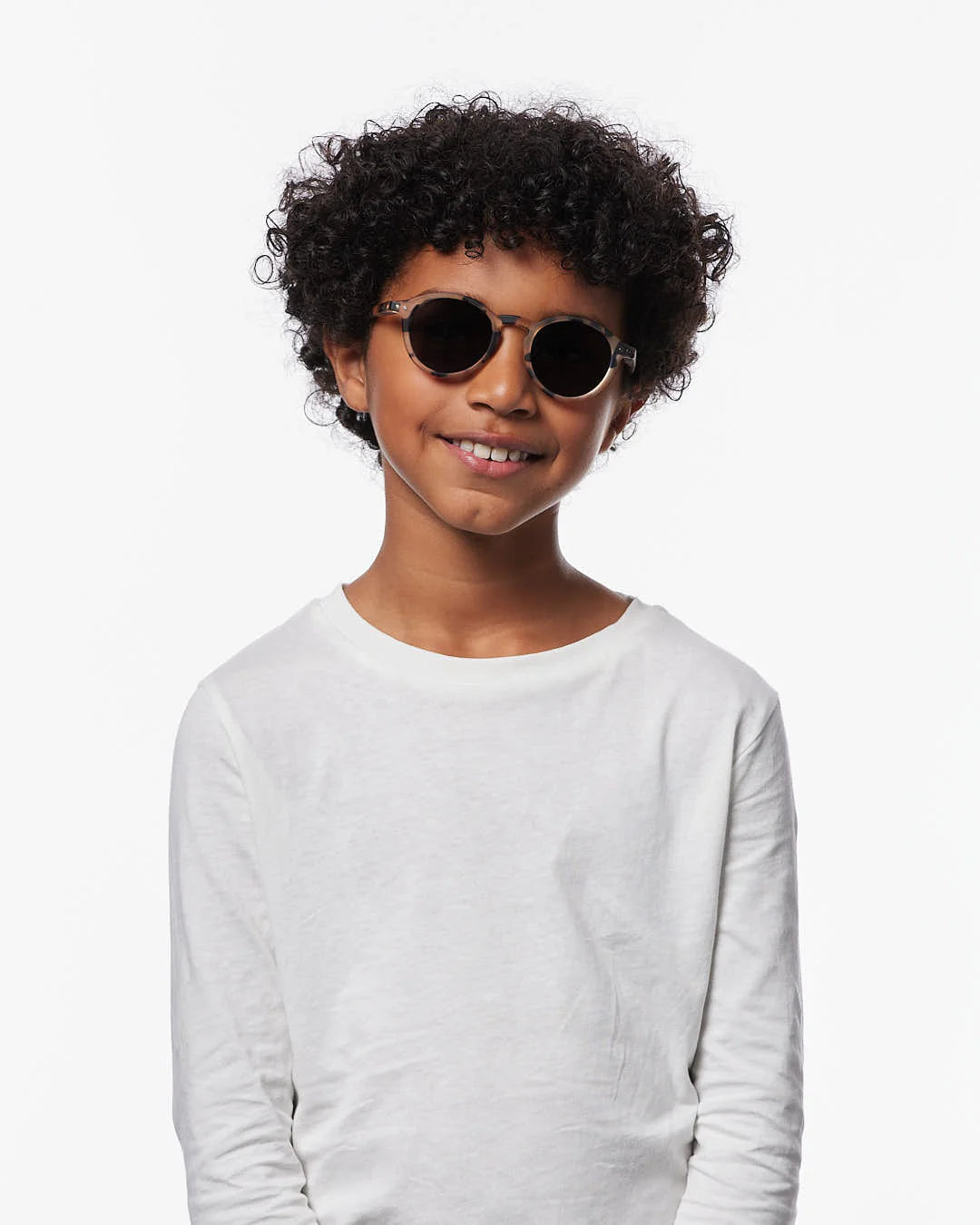 IZIPIZI Junior light tortoise sunglasses ages 7–11 — child wearing side