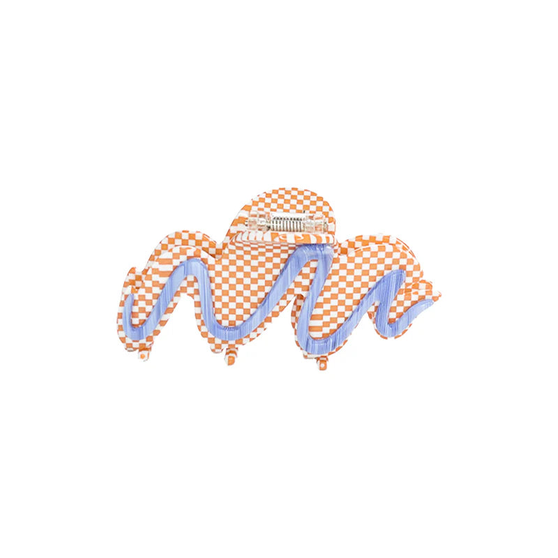 Decorative claw clip checkered pattern on a white background