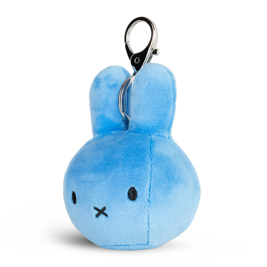 A light blue plush bunny Miffy keychain with embroidered black eyes and mouth, attached to a silver metal lobster clasp, on a white background.