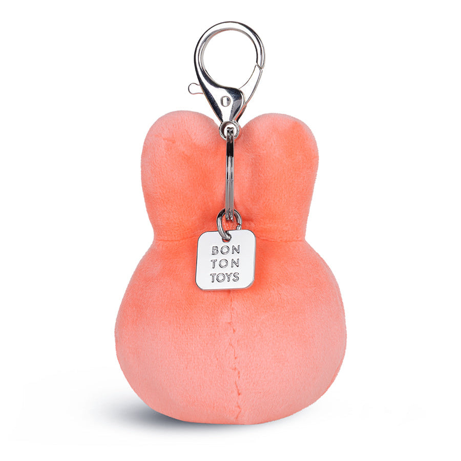 A coral pink plush bunny keychain with a silver lobster clasp and a hanging silver tag that reads 'BONTON TOYS' in black text, shown on a clean white background.
