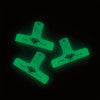 Hightide Penco Clampy glow-in-the-dark binder clip shown glowing