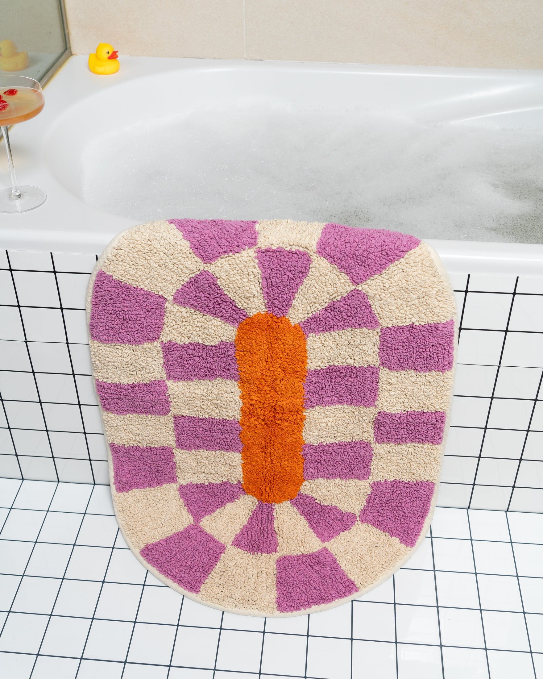 Rita bath mat magenta by Tarta Gelatina, lifestyle shot in bathroom