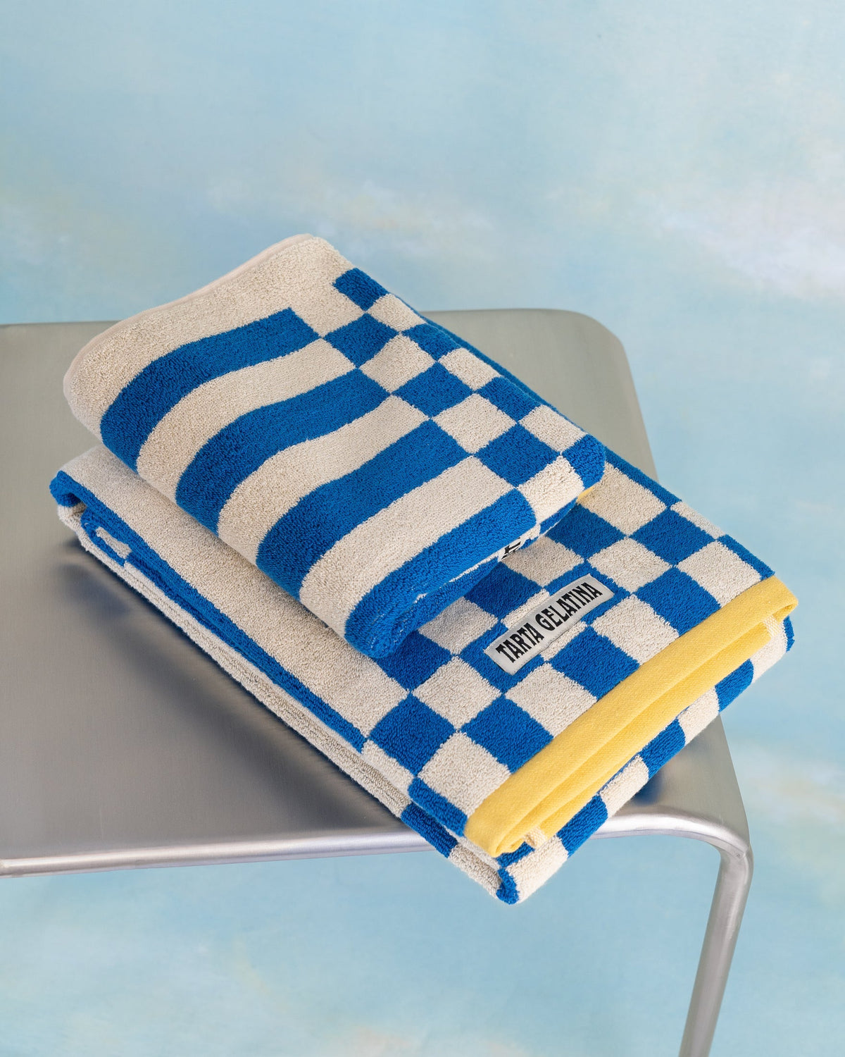 Clubhouse bath towel blue by Tarta Gelatina, flat lay showing full size