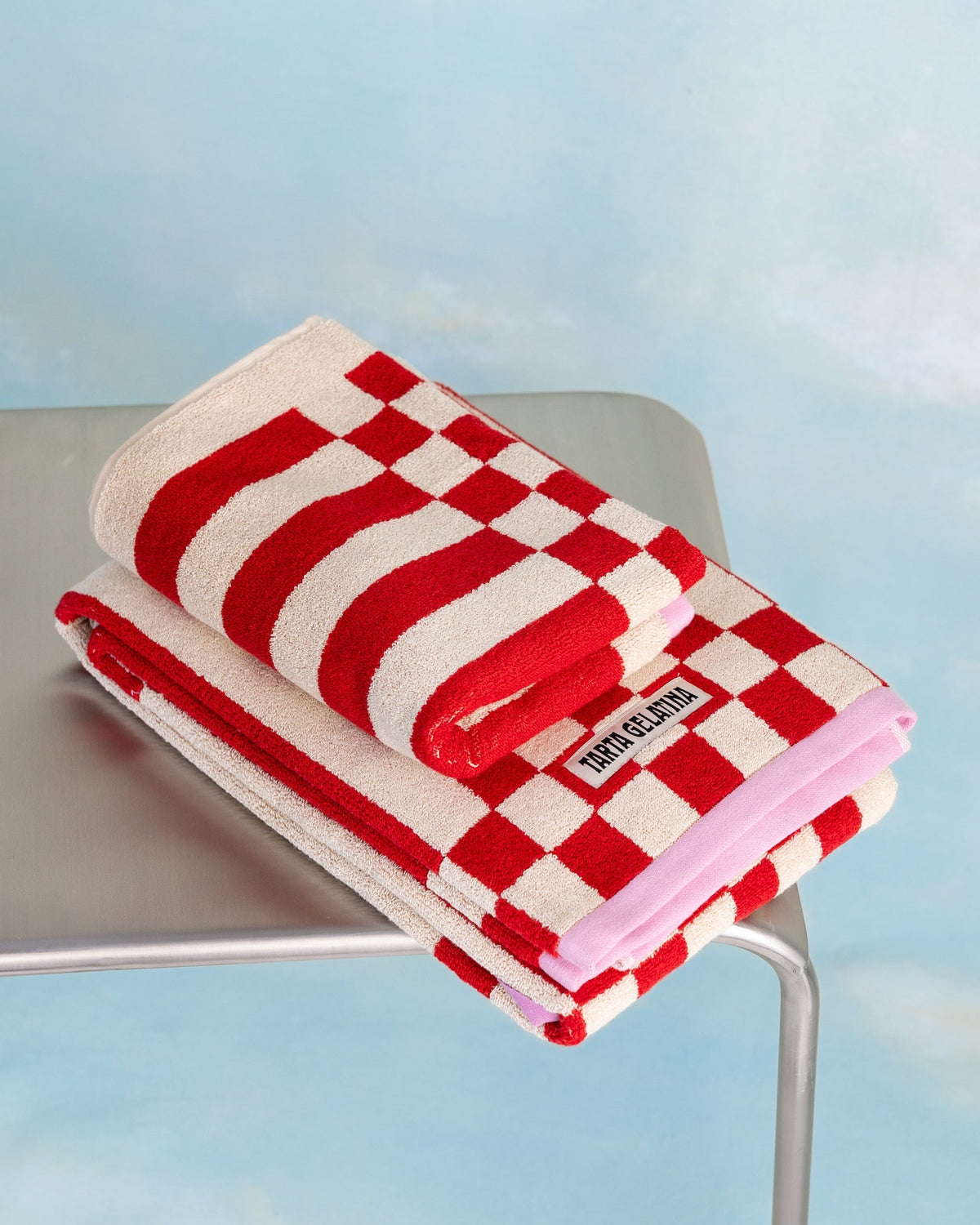 Clubhouse bath towel red by Tarta Gelatina, flat lay showing full size