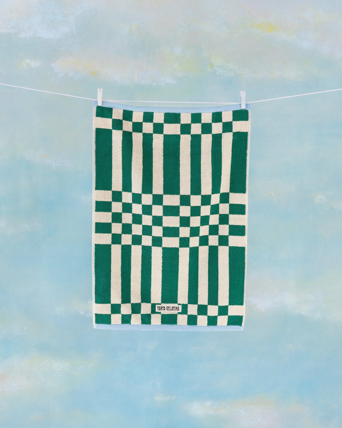 Marina bath towel green by Tarta Gelatina, lifestyle shot in bathroom