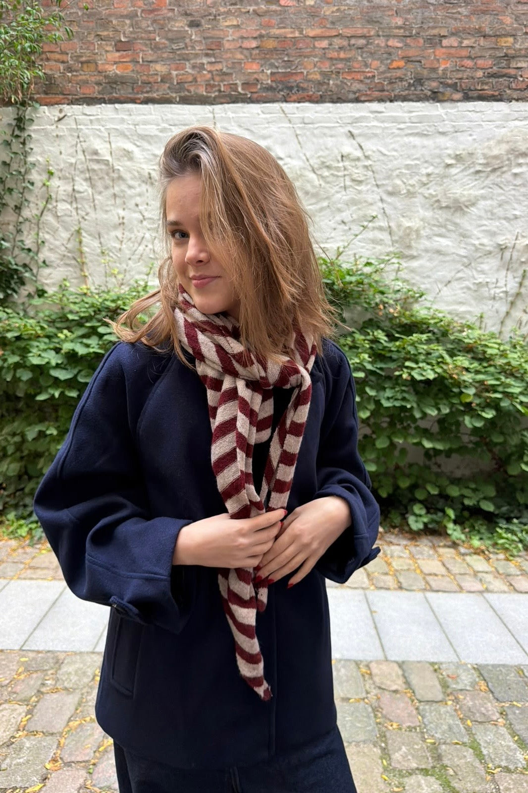 Bordeaux and taupe striped oversized triangle scarf worn draped