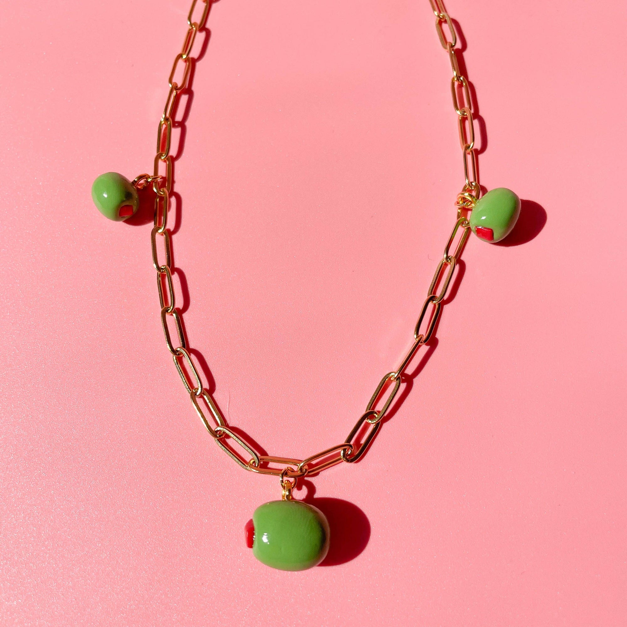 3 olive charms on necklace