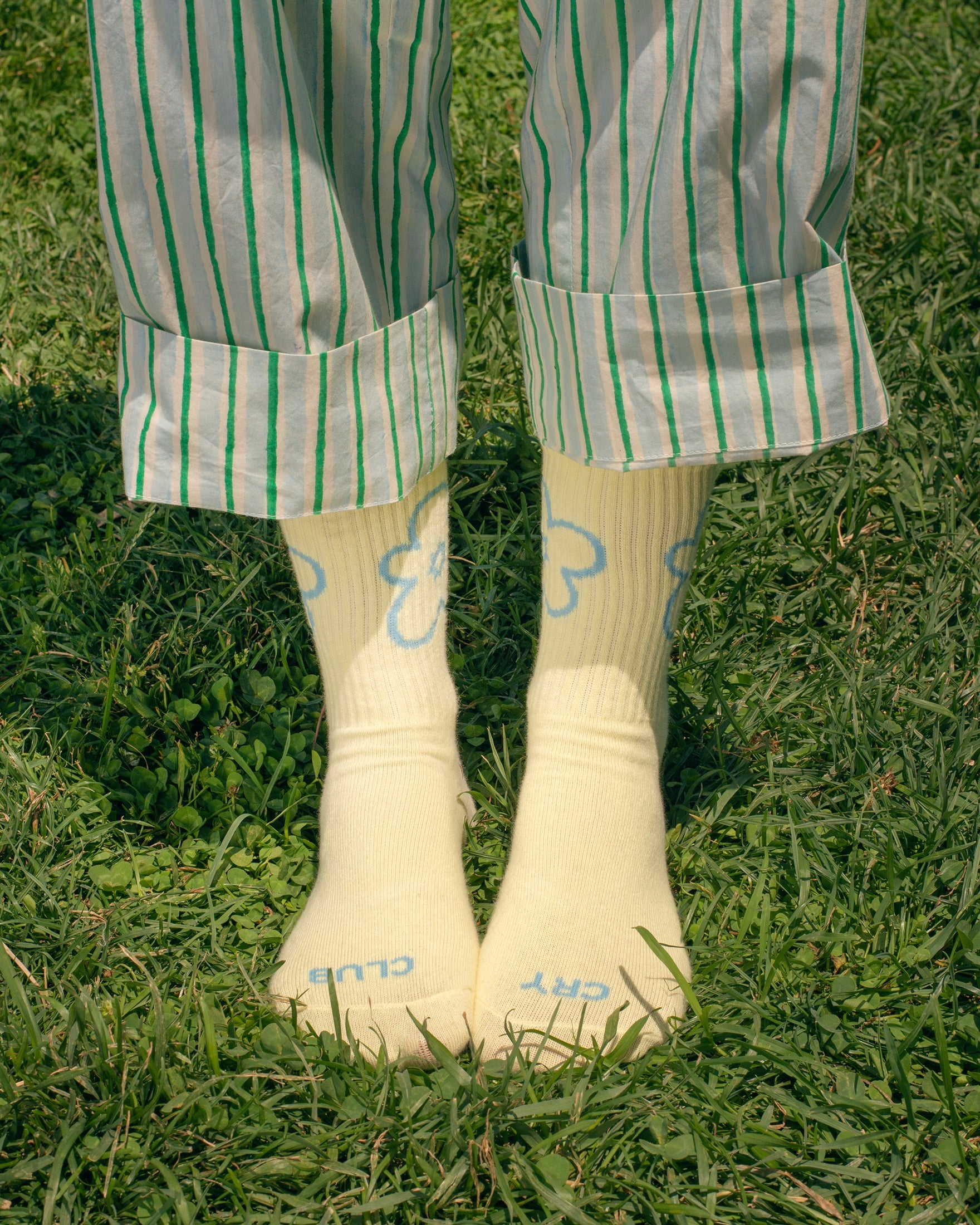 Tarta Gelatina Cry Club yellow socks, side angle showing fabric texture